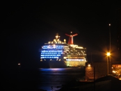 lightened cruise ship passing by